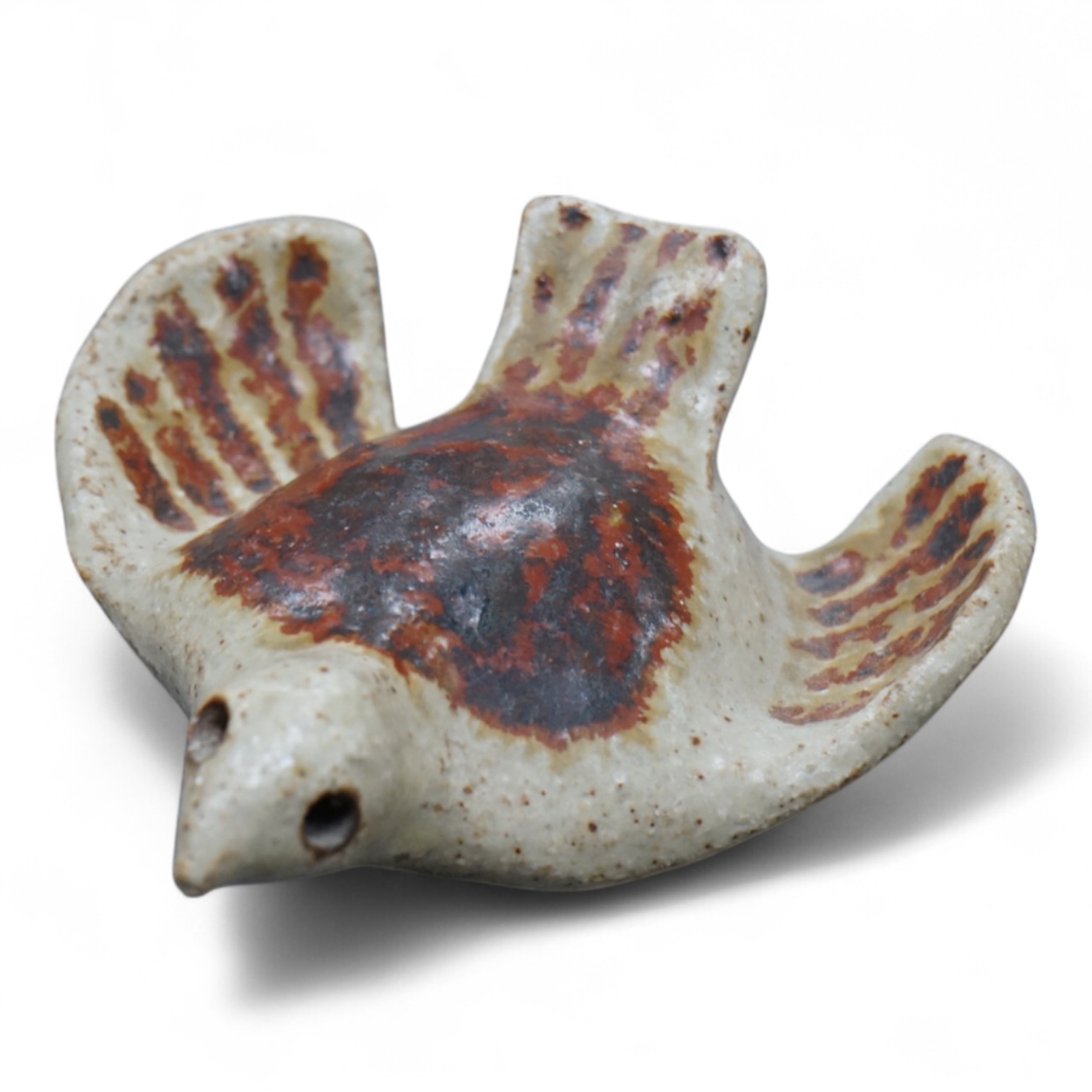 Eric James Mellon (1925 - 2014), a small studio pottery and apple ash-glazed model of a bird, 10cm wide